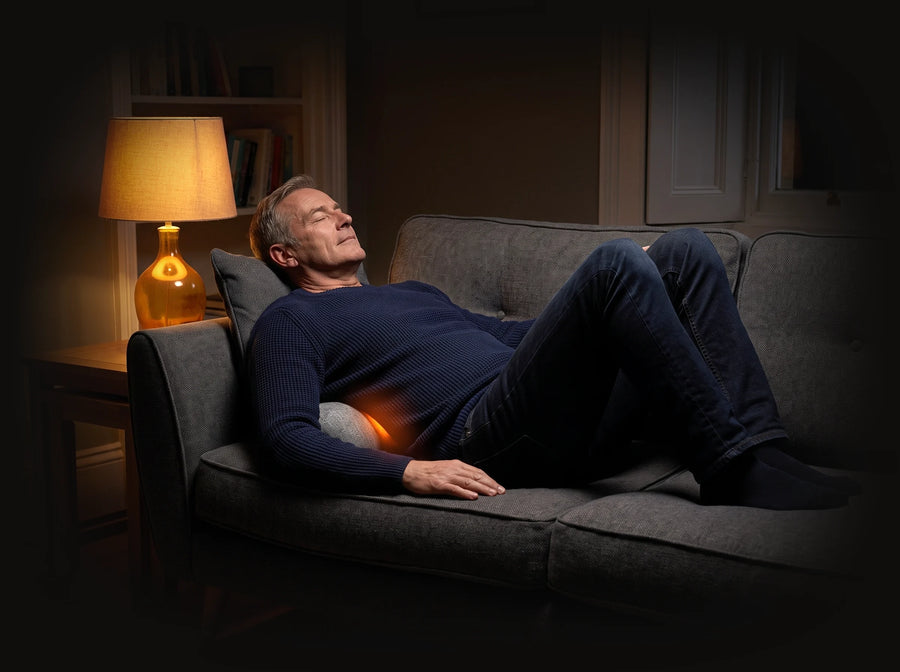 Lying back on the sofa with Unbent under the lower back
